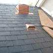 slate roof with copper flashing and copper ogee gutter